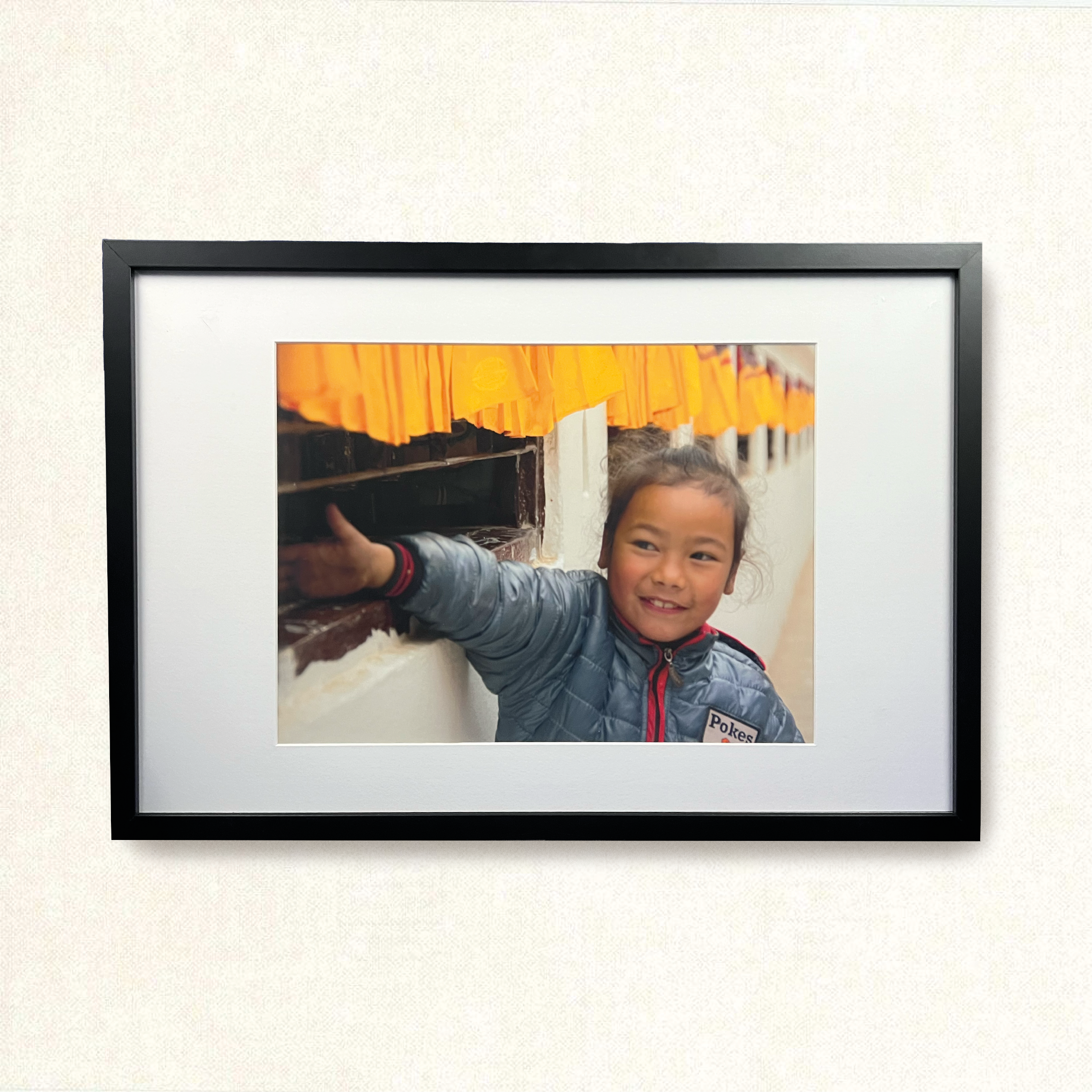 Girl rollings prayer wheels